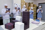 この日参加していたのは20人ほど。全員が紺色の手帳「こづち」を持参して臨む。