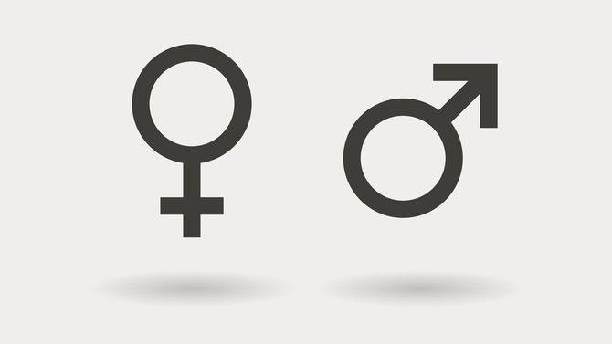 宙に浮く男女の性別記号