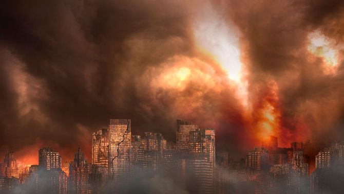 廃墟となった街や錆びたビルが炎上している様子