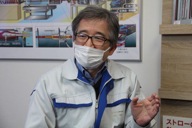 作業着姿の磯田社長