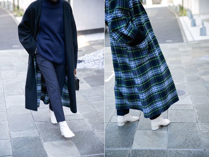 シンプルなブラックの無地と、カジュアルなチェック柄のリバーシブル。ほんのり起毛した上質なウール素材は着心地も抜群！　すっきりとしたノーカラーで、合わせるインナーの襟を選ばない。共布のベルト付き。コート6万円／カレンソロジー