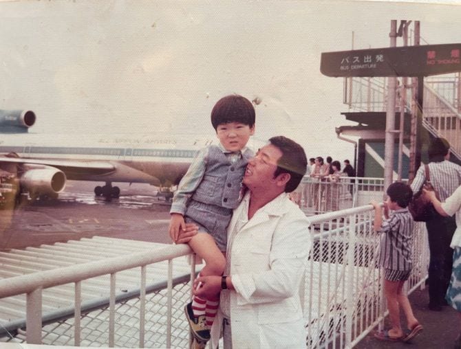 育ての父との写真