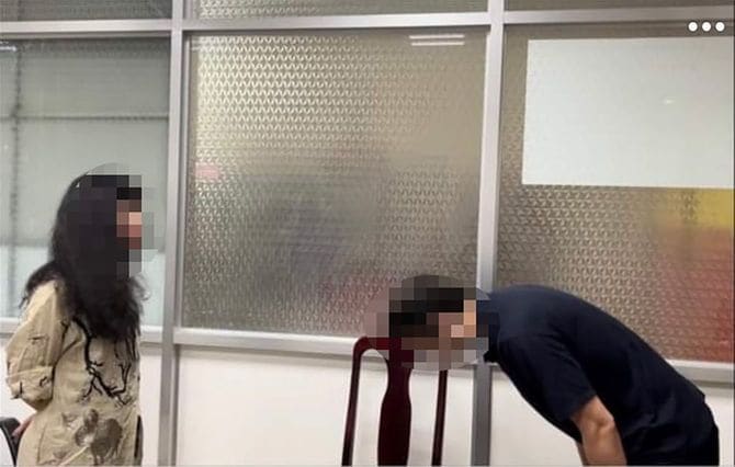 盗撮したベトナム人女性に謝罪する日本人男性