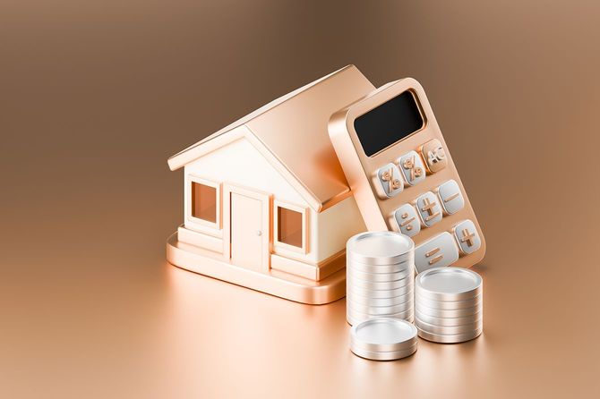 家の模型と電卓