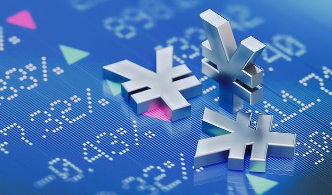 デジタルで表示された財務グラフの上に円記号のオブジェが転がる