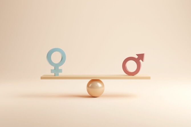男女平等の概念を表す天秤にかけられた性別記号