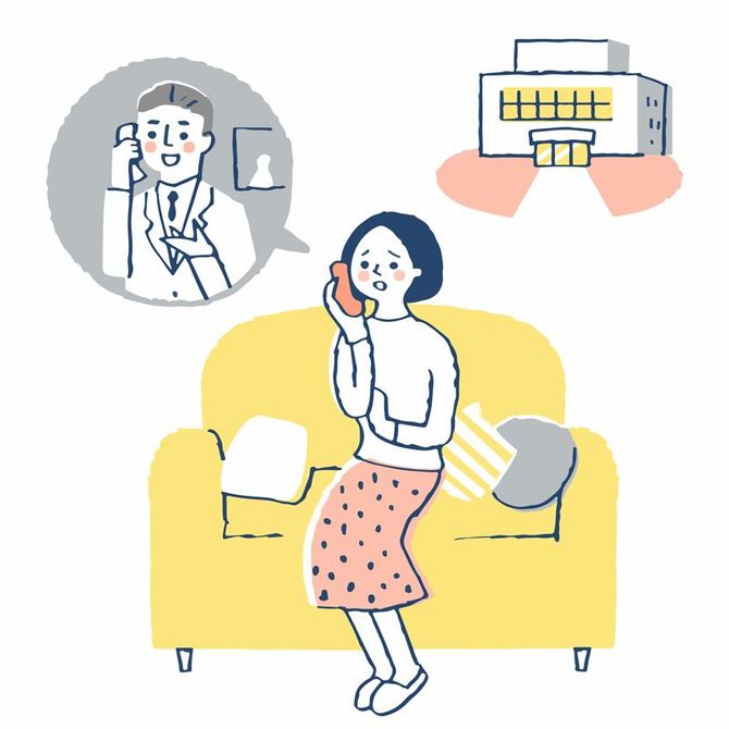 医療機関に電話で相談する女性