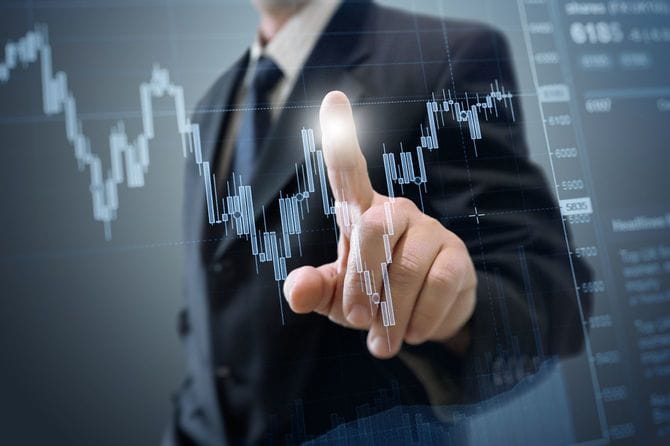 ビジネスマンと株式チャート