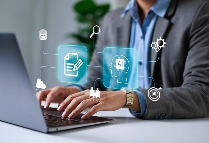 オフィスのラップトップでAIを制御するビジネスマン