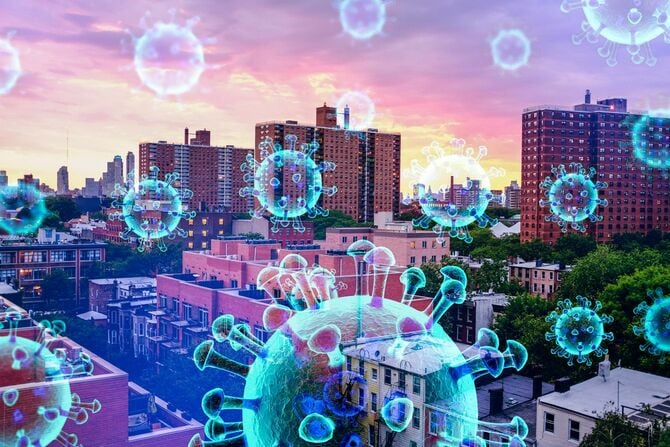 都市の街並みに浮かぶウイルスのイメージ