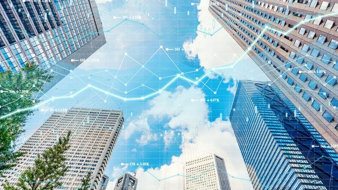 株式市場チャートと都内景観