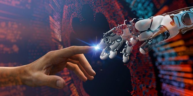 触れ合うAIロボットの手と人間の手